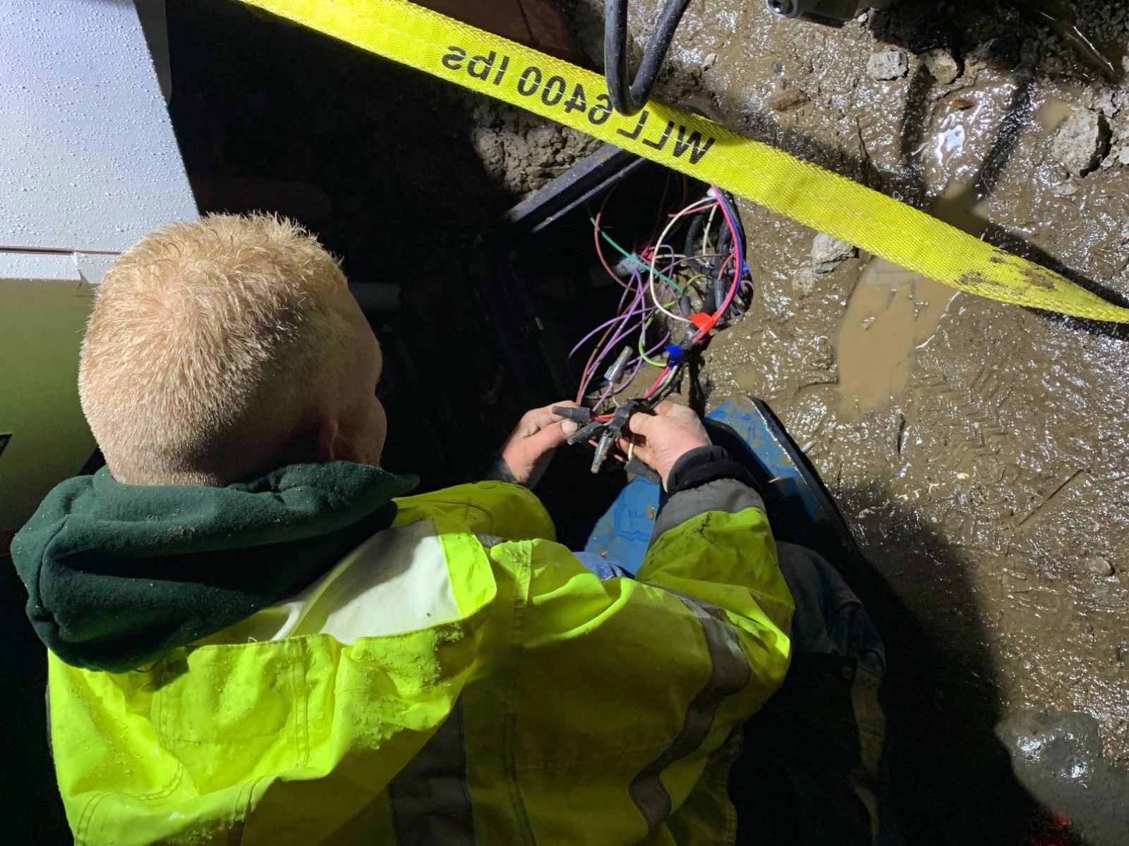 HES licensed electrician performing routine electrical maintenance