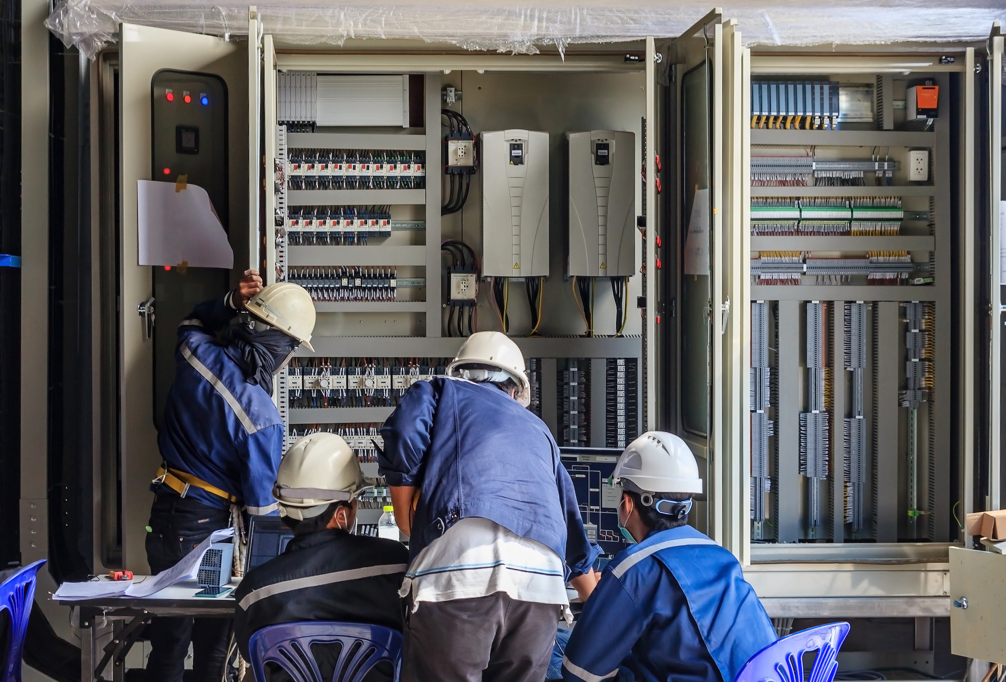 6843e884f2331f5695610c45 Electrician Technician At Work With Safety Equipment On A Residential Electrical System