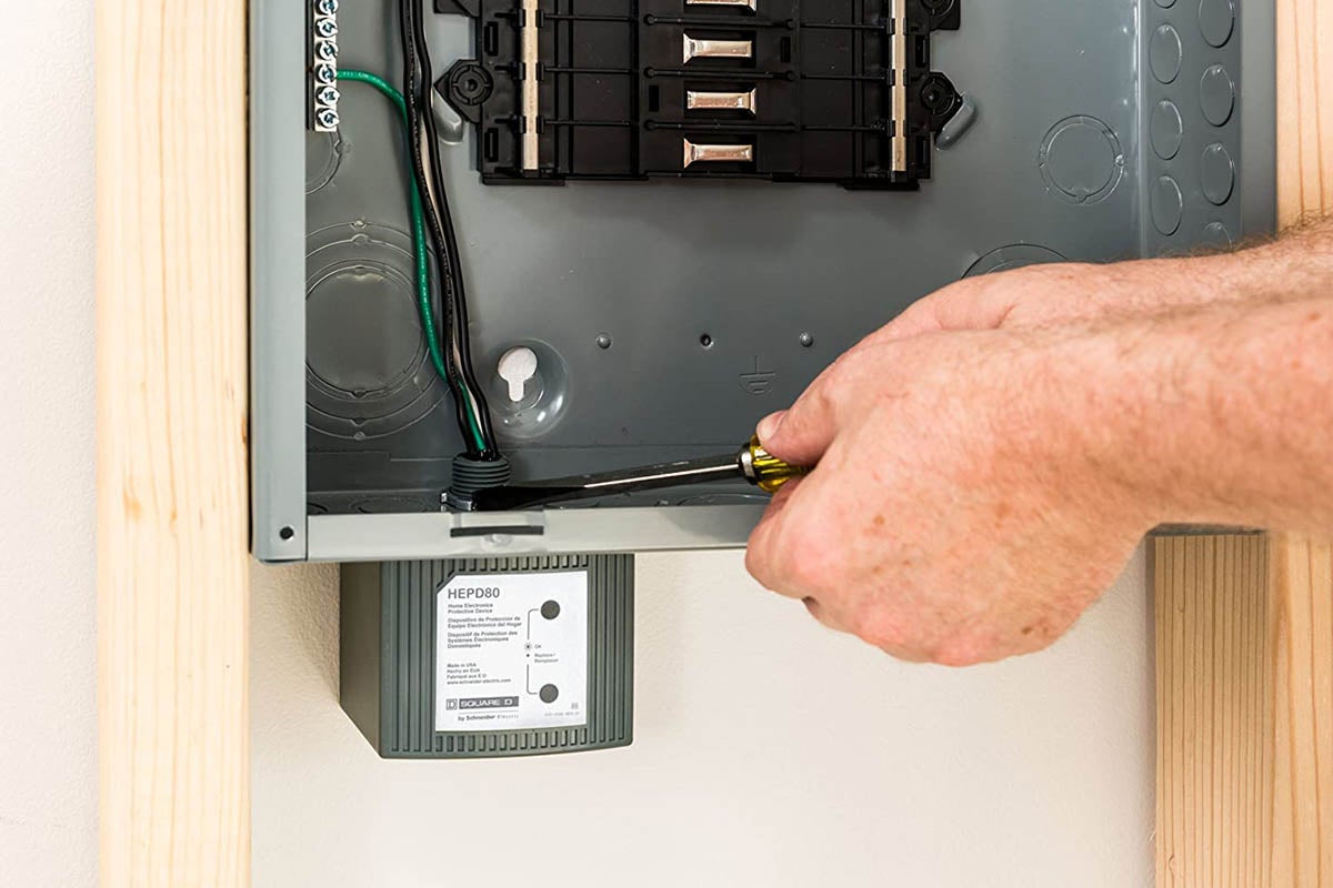 E78c7295332be16dba97aa0c40214745b01c7221 Electrician Technician At Work With Safety Equipment On A Residential Electrical System